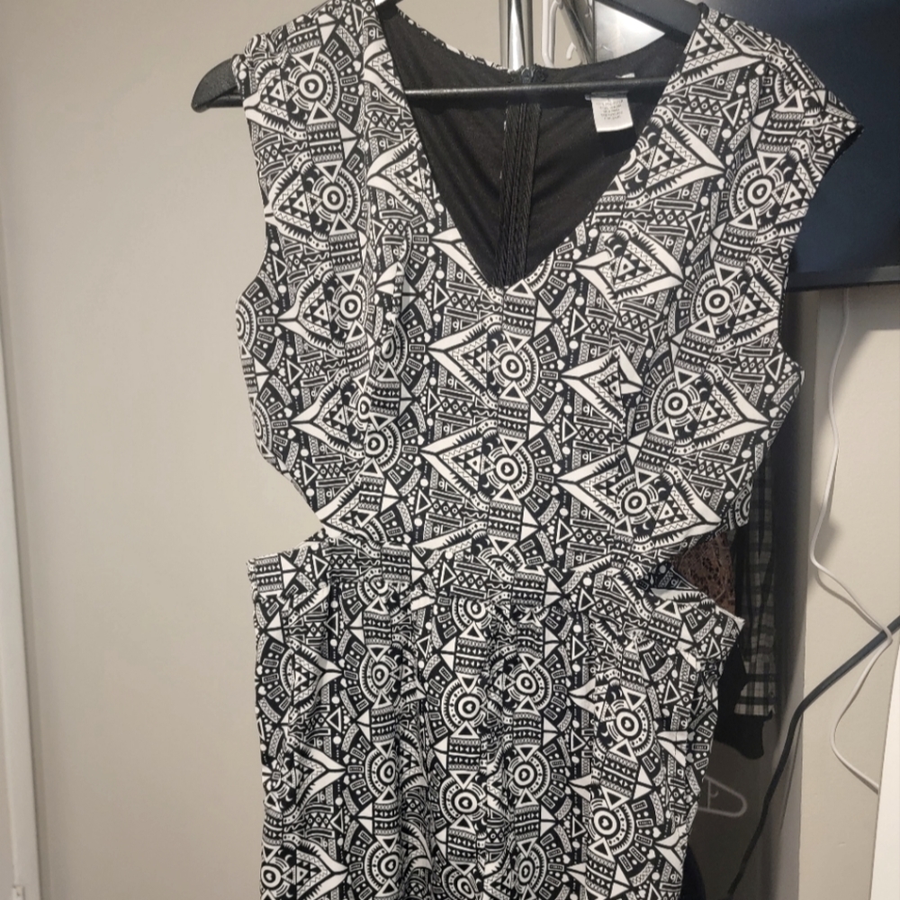 Dizzire Romper, Cute Crazy Pattern, Sides Cut Out, Short Shorts On The Bottom.
